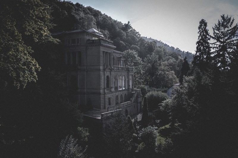 a historic building in neoclassical style surrounded by woods in heidelberg, neoclassical building 4k