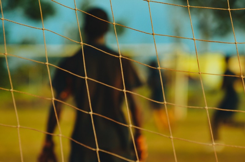 blurred goalkeeper through the focused goal net in new york texas, _goalkeeper through the soccer goal net 4k