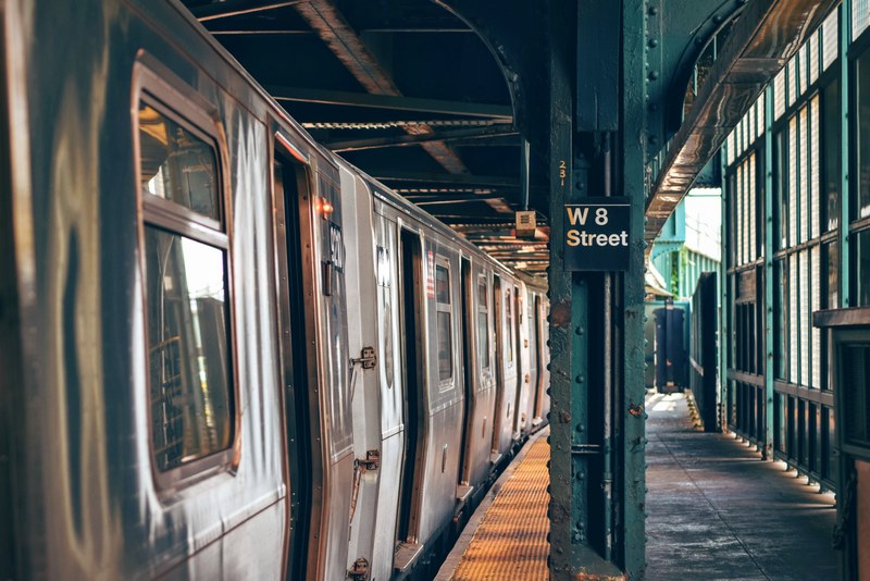 a train stopping at an empty platform in new york, new york rapid transit train 4k