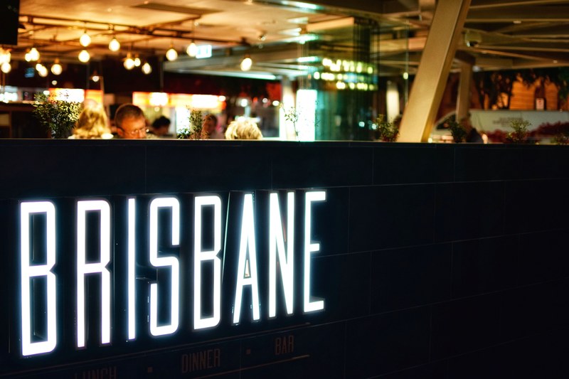 a bright white brisbane neon in a club, white brisbane neon 4k