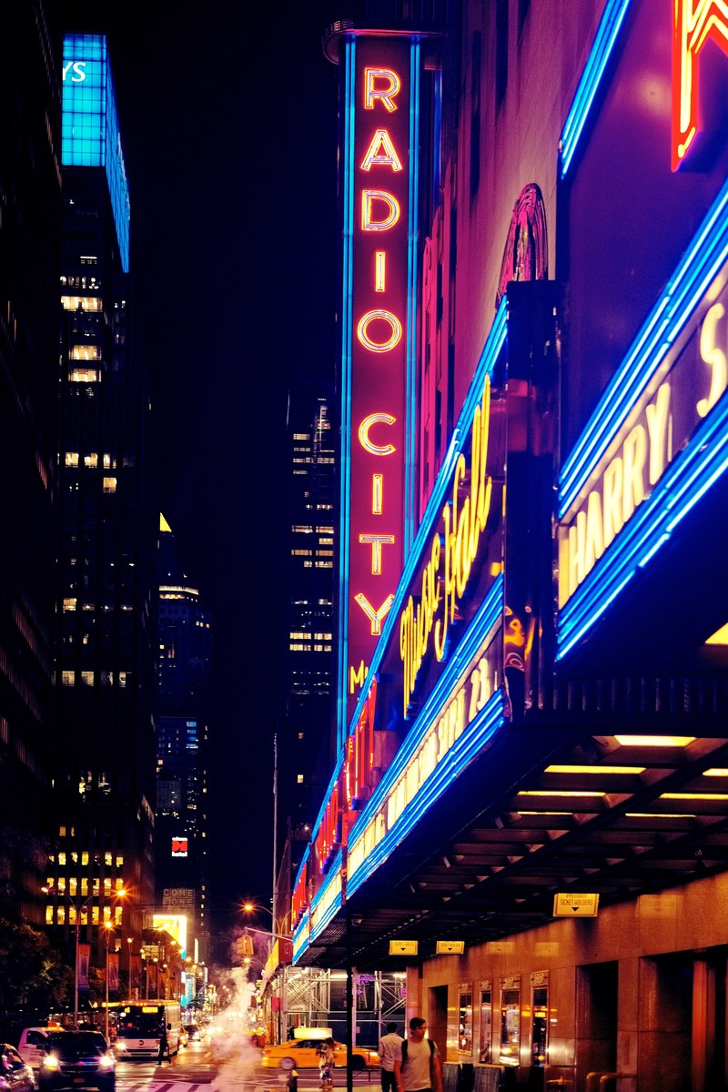 vertical and horizontal neons at the entrance to radio city music hall at night, radio city music hall neons at night 4k