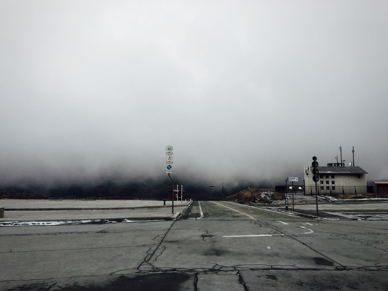 desolate roads meet at an intersection on a gray day, abandoned intersection 4k