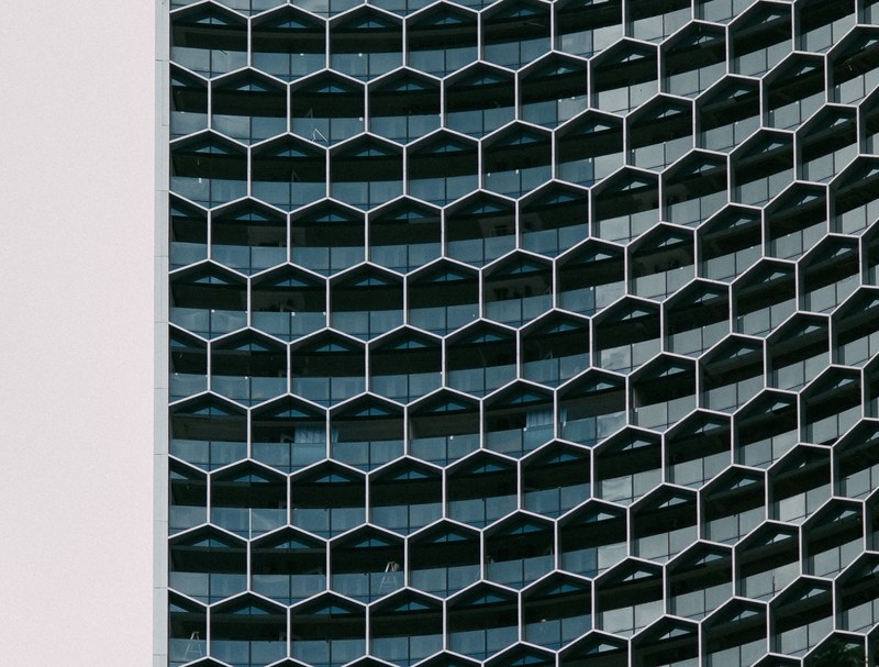 a building with glass hexagon shaped windows, hexagon windows 4k