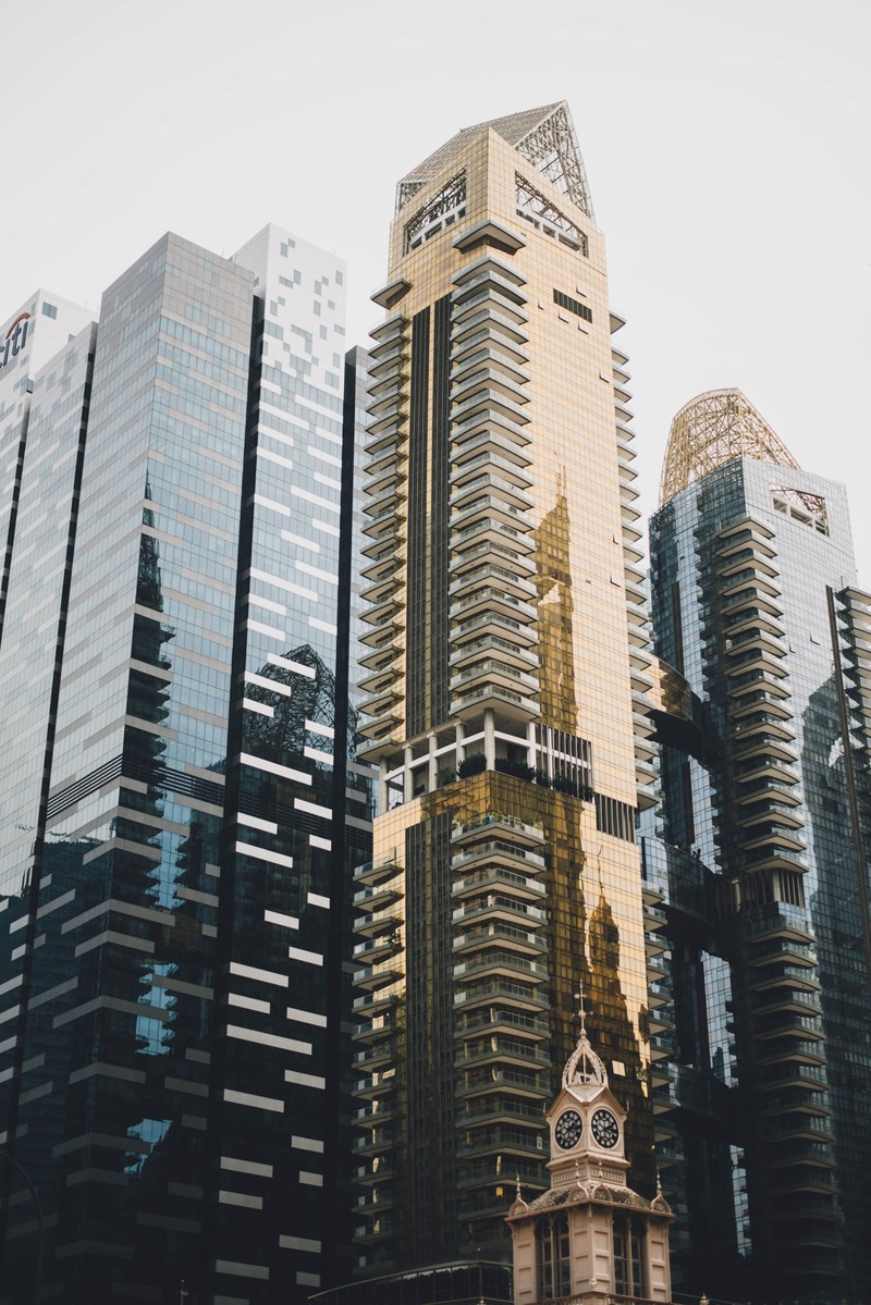 reflective facades of tall skyscrapers in a city centre, corporate headquarters 4k