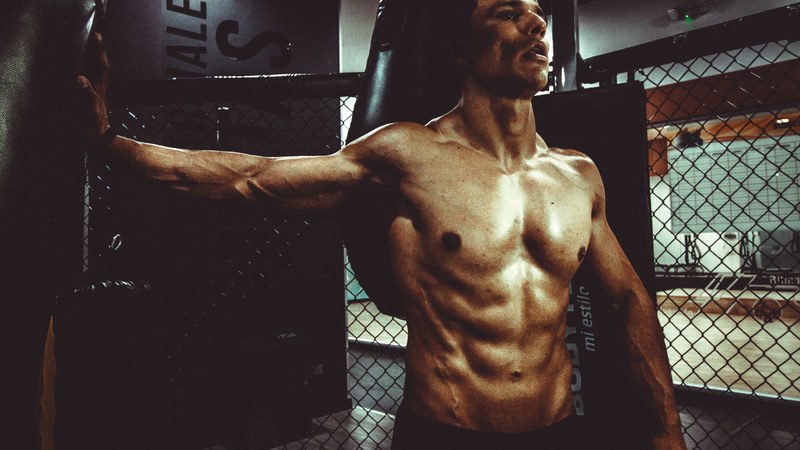 a fit shirtless man standing in a gym at centro comercial centro mayor, fit man 4k