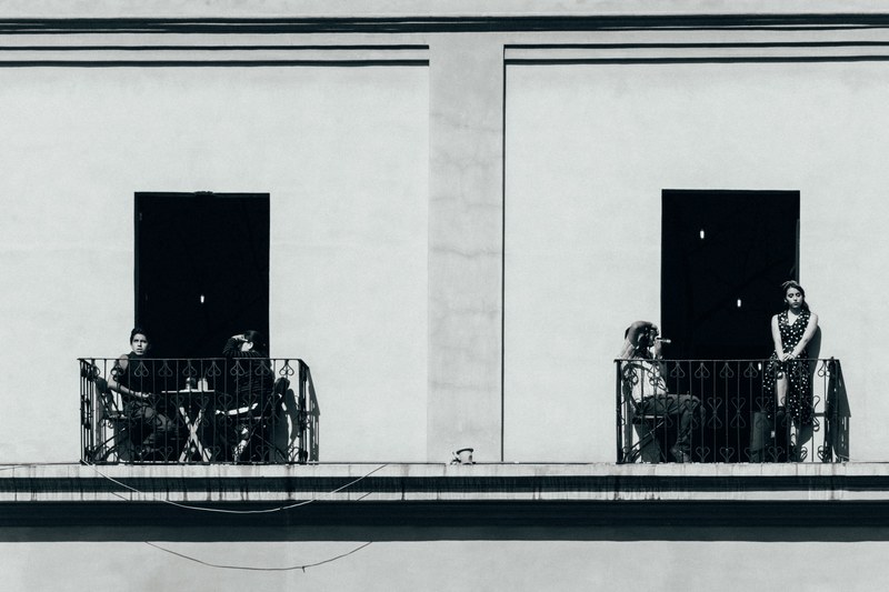 black and white of two balconies and people sitting and standing on them, people of tollohcan 4k