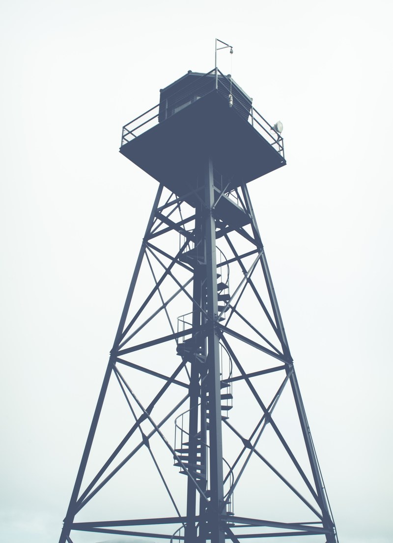 a prison guard watchtower in alcatraz island, watch tower gray sky 4k