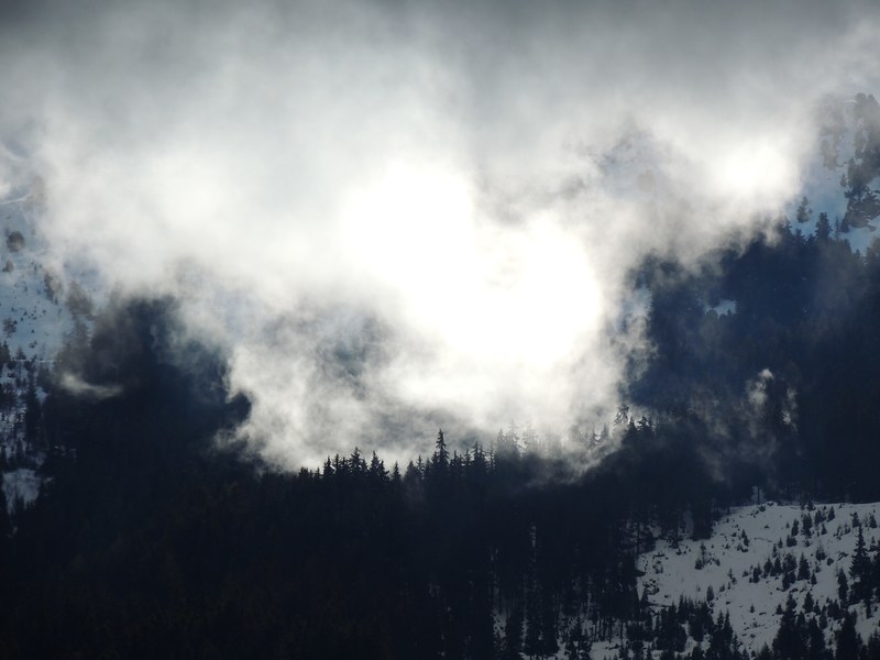 thick mist obscuring the view on a snowy mountainous landscape in modane, snowy mountains behind mist 4k
