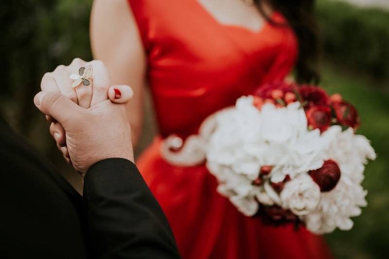 a man holds a womans hand during a wedding displaying her unique ring, 37 4k