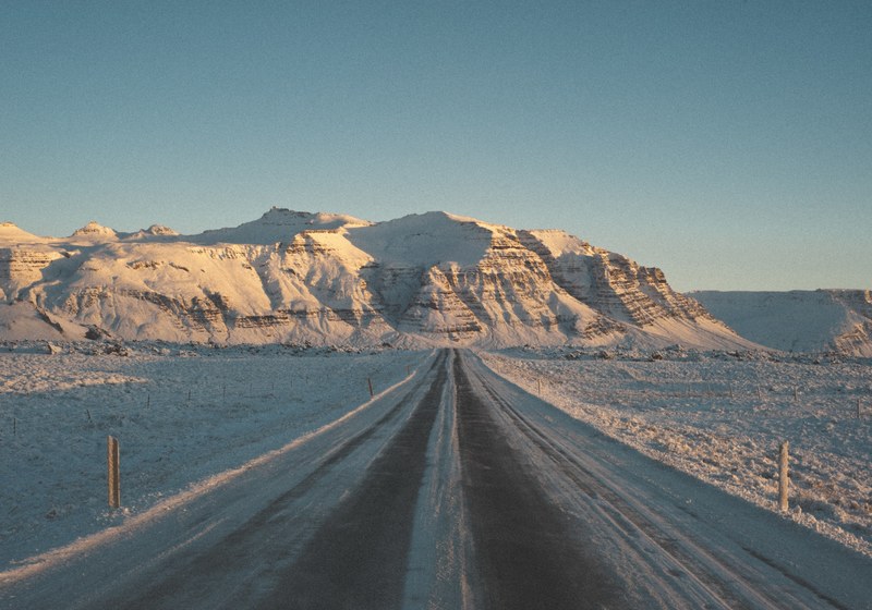 a snowy road near a plateau in snaefellsnes, road to the mountains 4k