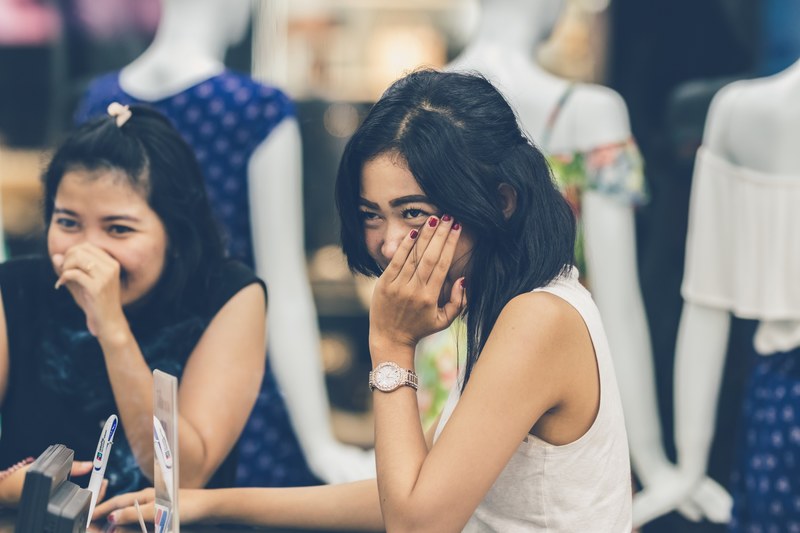 two young asian women in the shopping mall 4k