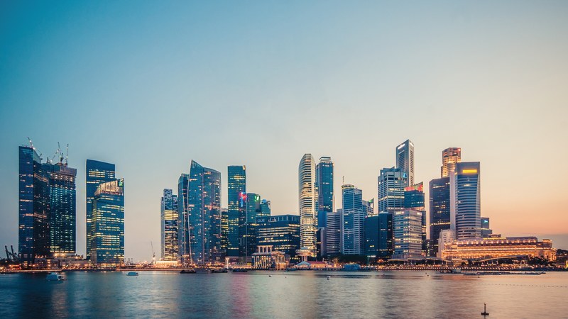 view of marina bay skyline and shores from the water during sunset, marina bay skyline sunset 4k
