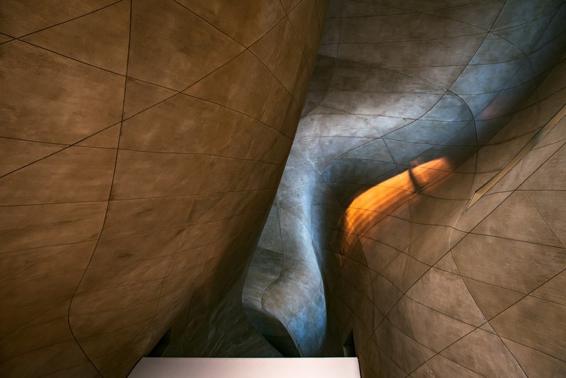 a twisted architectural sculpture of patterned tile walls in anielewicza, twisted sculpture 4k