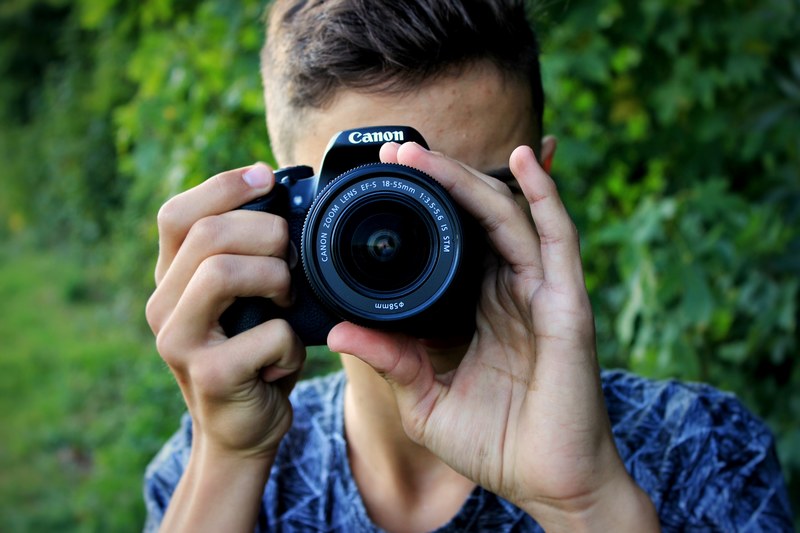 a guy taking a photograph with a canon camera in steckborn, steckborn canon camera 4k