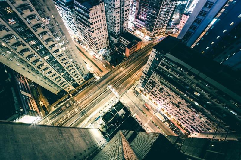 from up above looking down on a long exposure street scene at night in hong kong, hong kong night 4k