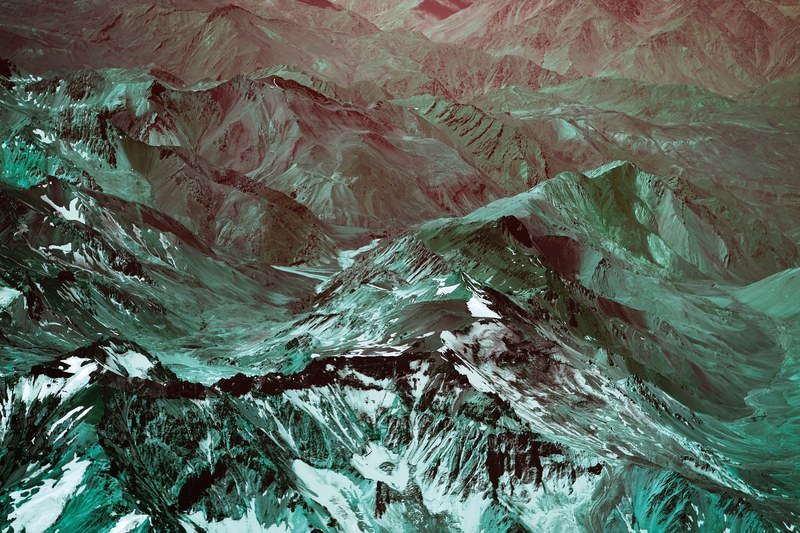 a green hued aerial shot of the sharp ridges in the andes, duo andes 4k