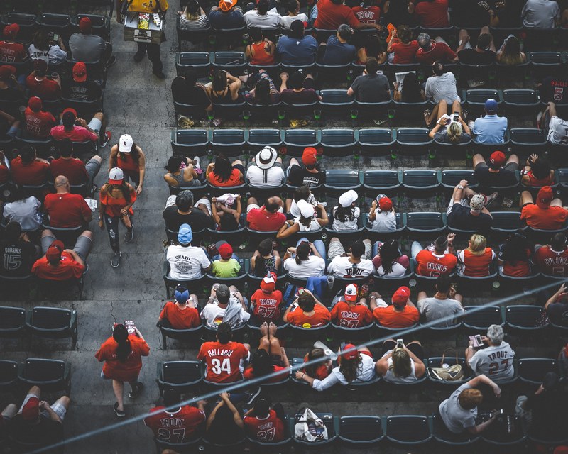 overhead a diverse crowd of sports fans sitting in a statium for a game, americas pastime 4k