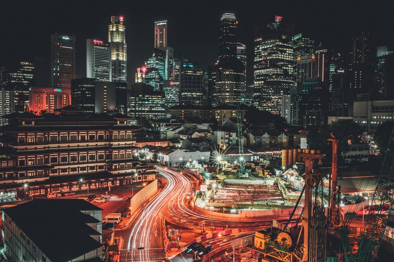 a lively image of street and building lights on a busy night in singapore, just another night_ 4k