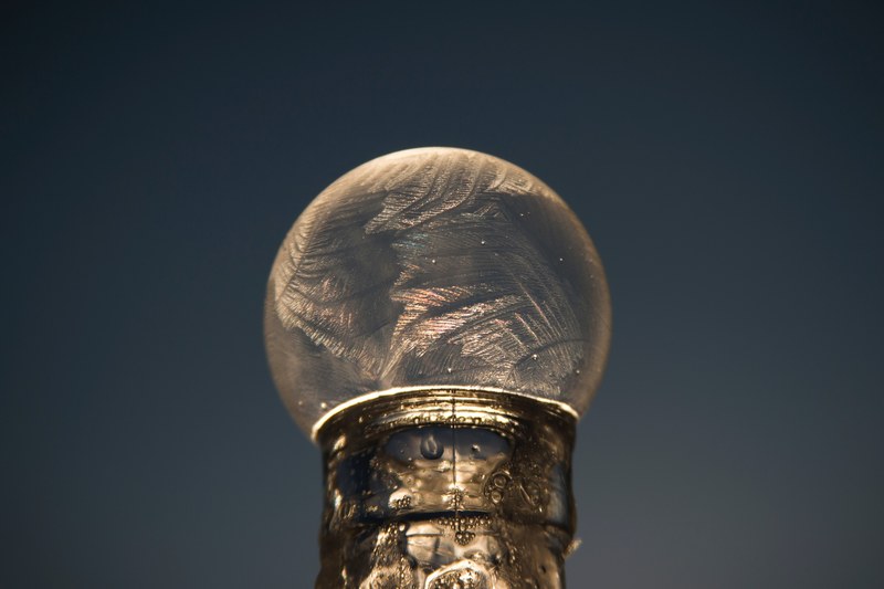 close up of a frozen bubble atop a bottle at billings montana seen against a clear sky, frozen bubble billings montana 4k