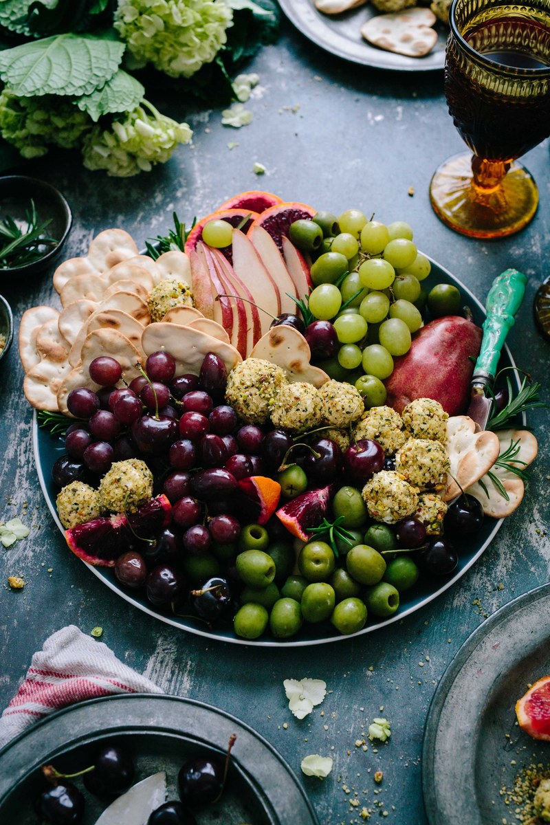 a large plate of grapes and olives, _winter fruit platter 4k