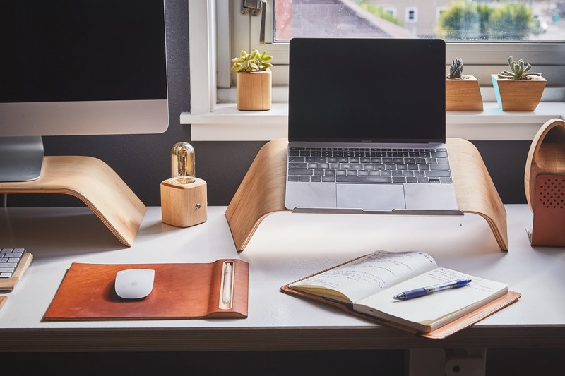 a busy workspace with an imac a macbook and an open notepad, notepad on a busy workspace 4k