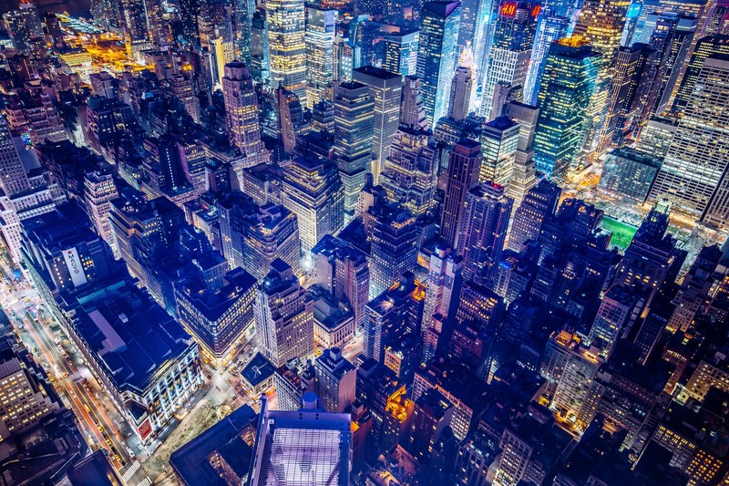 the new york skyline from the top of the empire state building at night lit up, the city 4k