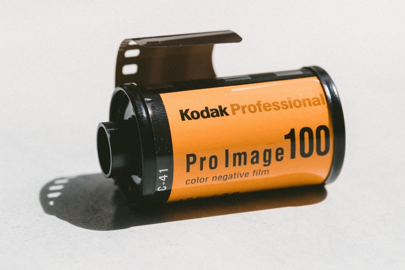 kodak professional pro image 100 color negative film canister with film peeking out, film a dying art 4k