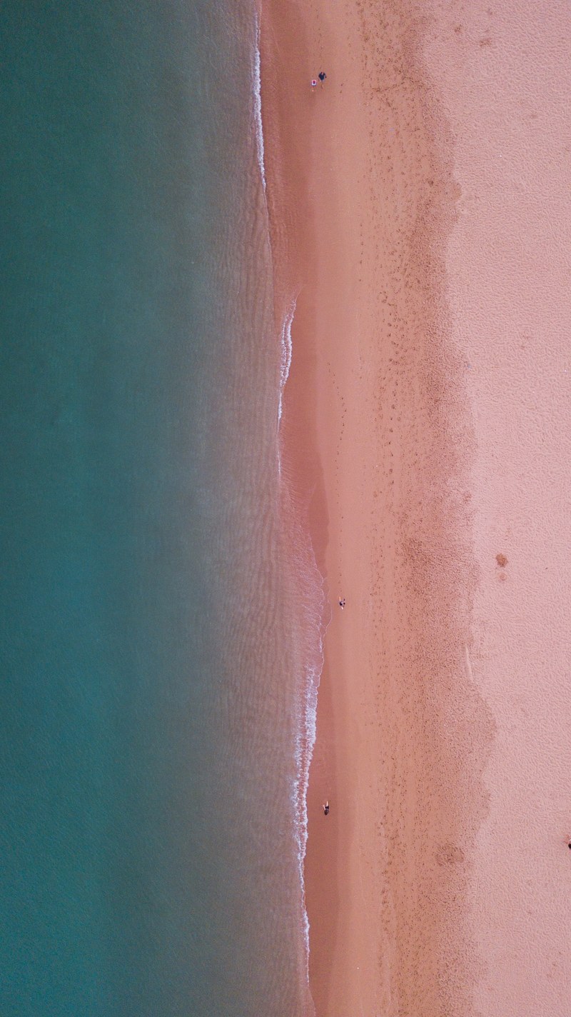 drone aerial view of the sand beach stretch at albufeira faro portugal, beach contrast 4k