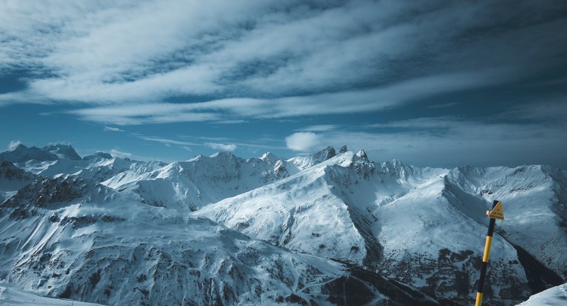 a frozen alpine landscape with snow capped mountain peaks in vallorie, snowy mountains in valloire 4k