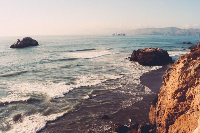 wavy shores near rocky beach bluffs in point lobos, coastal views 4k