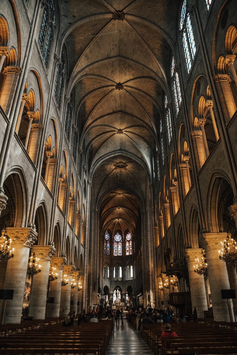 a long walkway in a historical church with high ceilings and beautiful interior architecture, _inside notre dame 4k