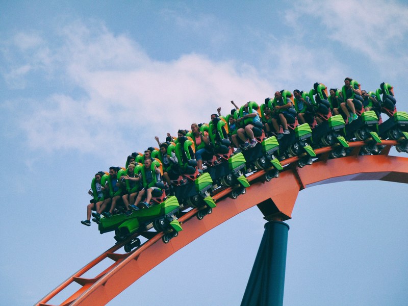 roller coaster on red track with excited people, excited people green rollercoaster 4k