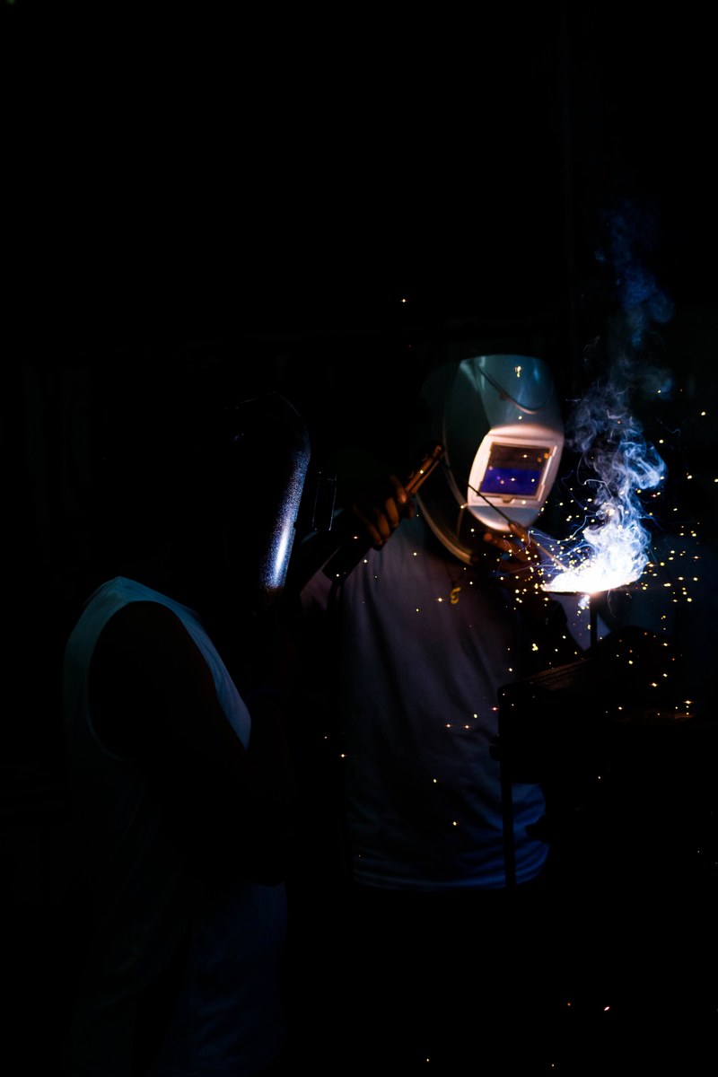 two people weld in the dark in nejapa, in the making 4k