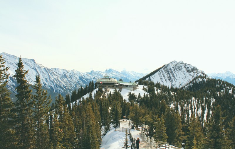 a ski resort on top of a snowy slope in banff, banff monorail station 4k