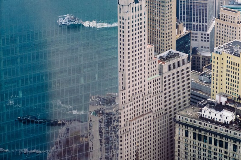 the reflective facade of a tall skyscraper in new york, one world trade center 4k