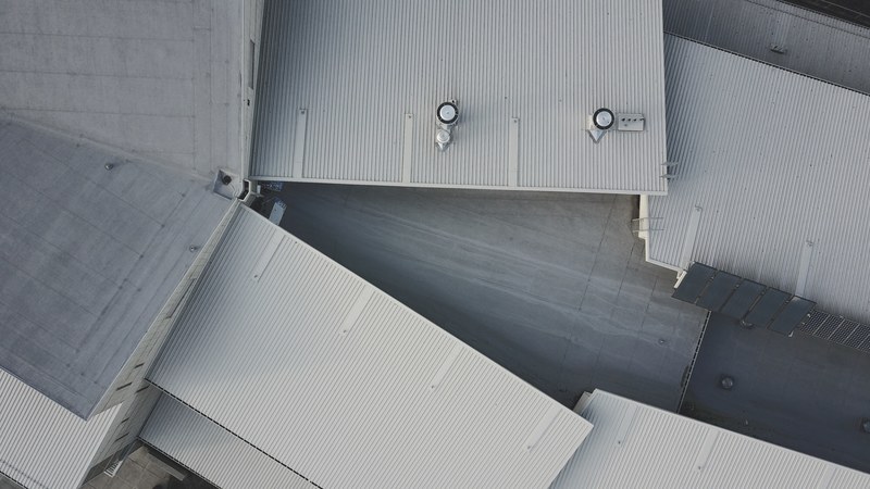a drone shot of white industrial buildings, white industrial buildings 4k