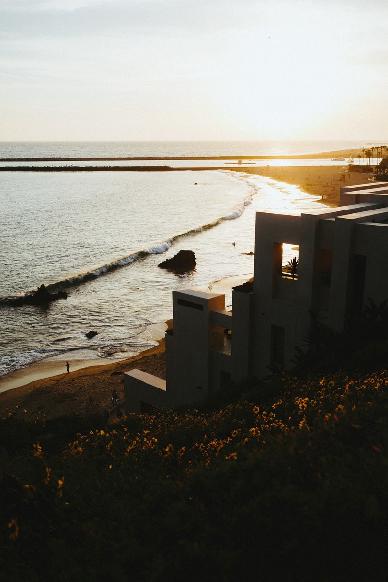 house on the sandy beach coastline in corona del mar at sunset, corona del mar mansion 4k
