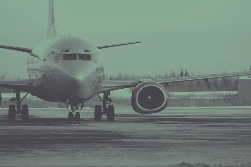 a desaturated shot of the front of a passenger plane on the runway, plane nose on the runway 4k