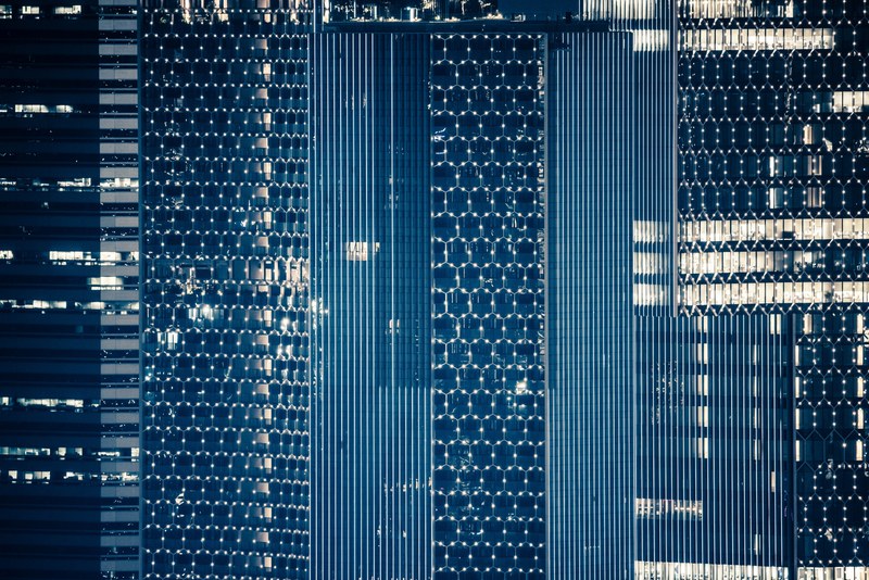 macro of skyscrapers windows that are framed by light in honeycomb pattern, skyscraper honeycomb windows 4k