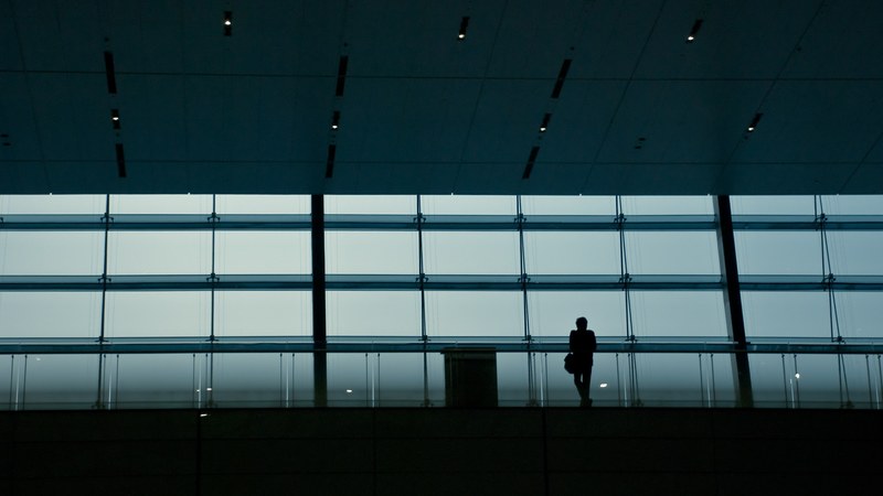 a silhouette of a person in a dark railway terminal, railway terminal silhouette 4k