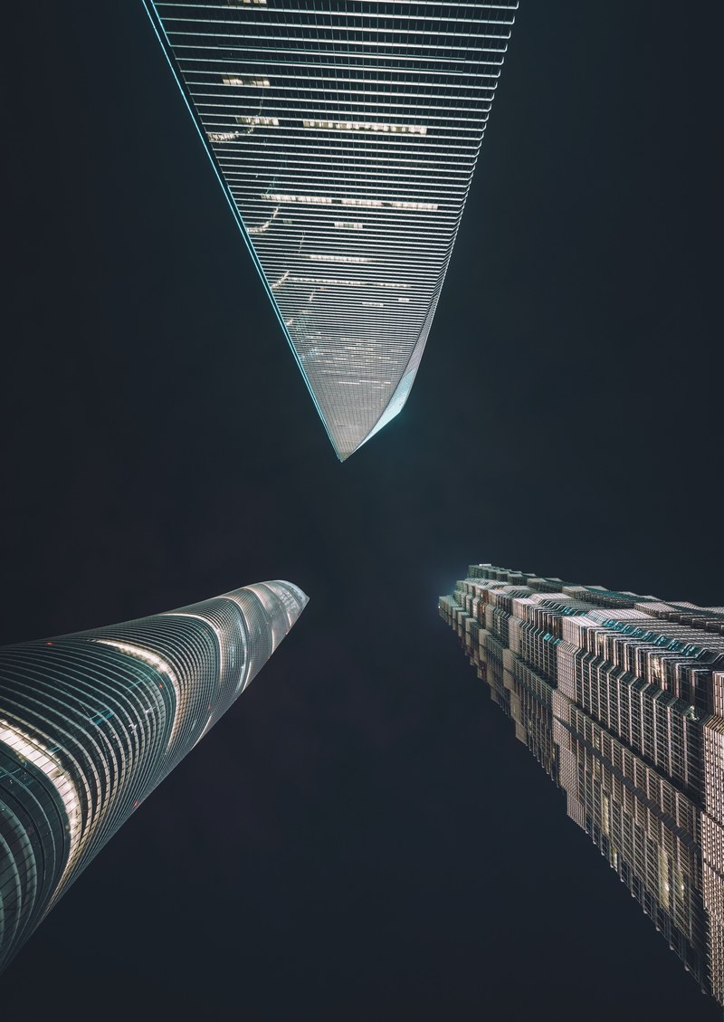 a low angle shot of three impressive skyscrapers in shanghai, trinity 4k