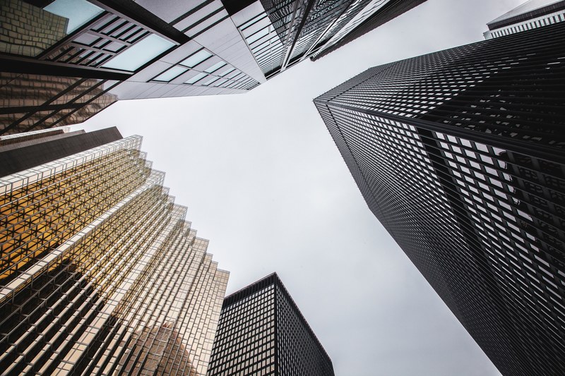 a low angle shot of several distinct skyscraper facades in toronto, modern skyscraper facades 4k