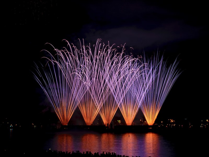 colorful fireworks with the reflection in water at english bay beach, honda celebration of light fireworks 4k