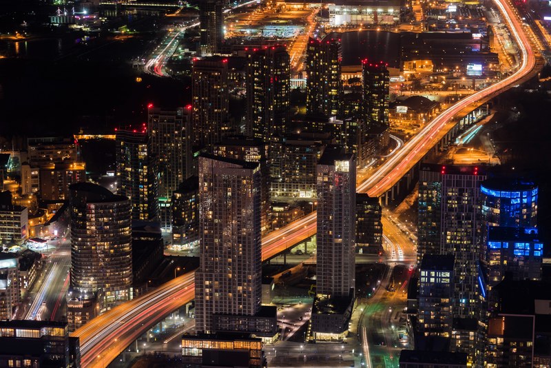 aerial drone shot of a bustling metropolis at night, night in toronto 4k