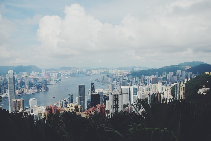 high rises and skyscrapers in a large city on the shore of a river, urban shores 4k