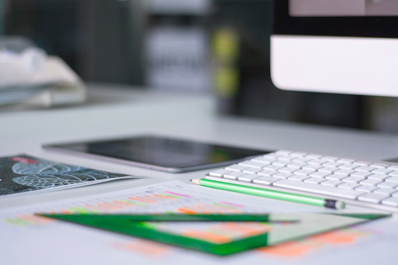 busy but orderly workspace with highlighted notes a set square and a tablet, working at office 4k