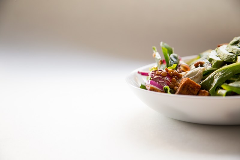 fresh vegetable salad in a white bowl in the kitchen, eat veggies 4k