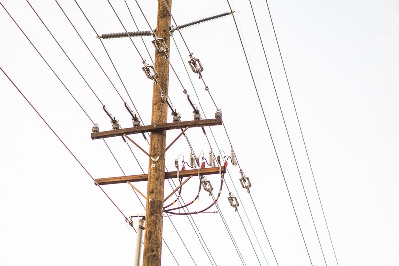 a macro shot of power lines in a cloudy white sky, power lines in the sky 4k