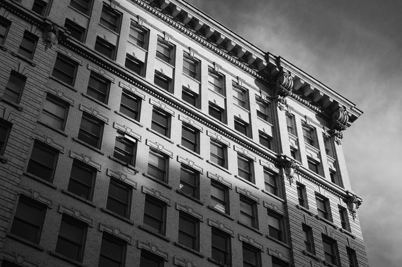 a black and white short of a neoclassical building facade, classic office space 4k