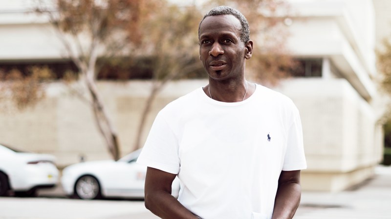 a man wearing white t shirt standing on the street, man standing on street 4k